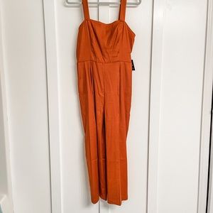 Express jumpsuit. Linen blend. Ankle length. Pockets. Open tie back. BRAND NEW!